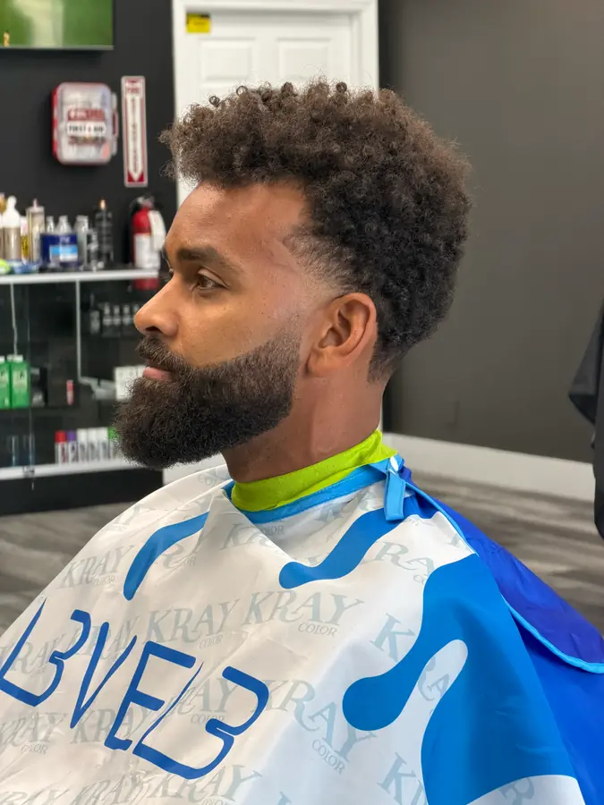 Beard sculpt and mid fade under the cape