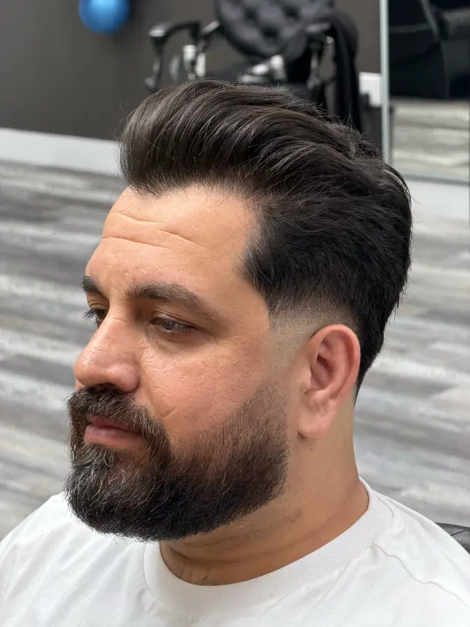 Volume swept back over a taper, with a shaped full beard