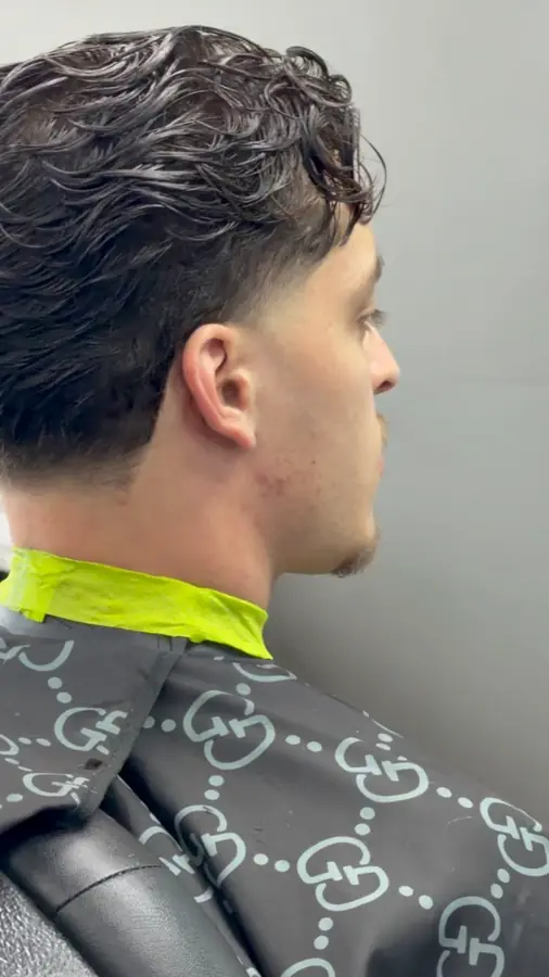 Textured top and a tapered back, seen from behind